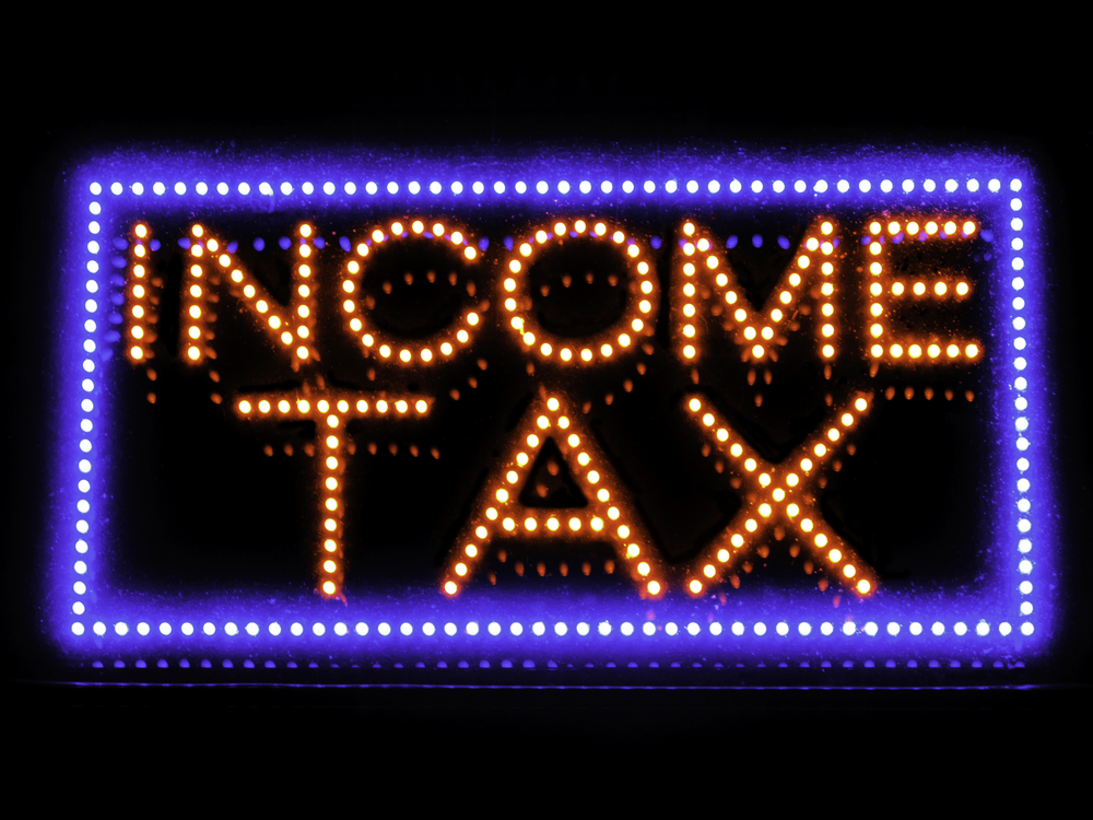 Neon sign in window of local accounting service Neon sign in window of local accounting service